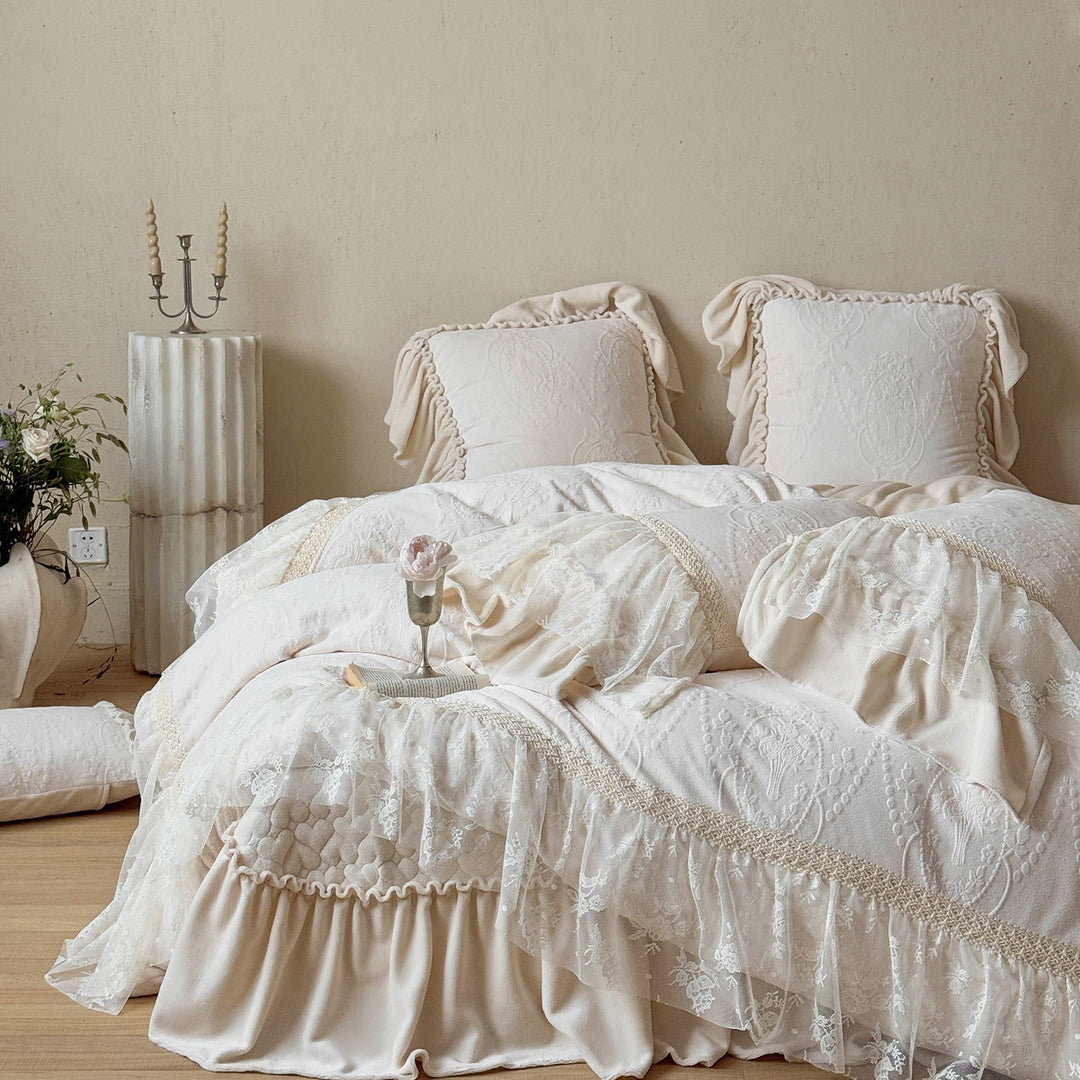 Romantic bedding set with lace trim, ruffle, and quilted blanket