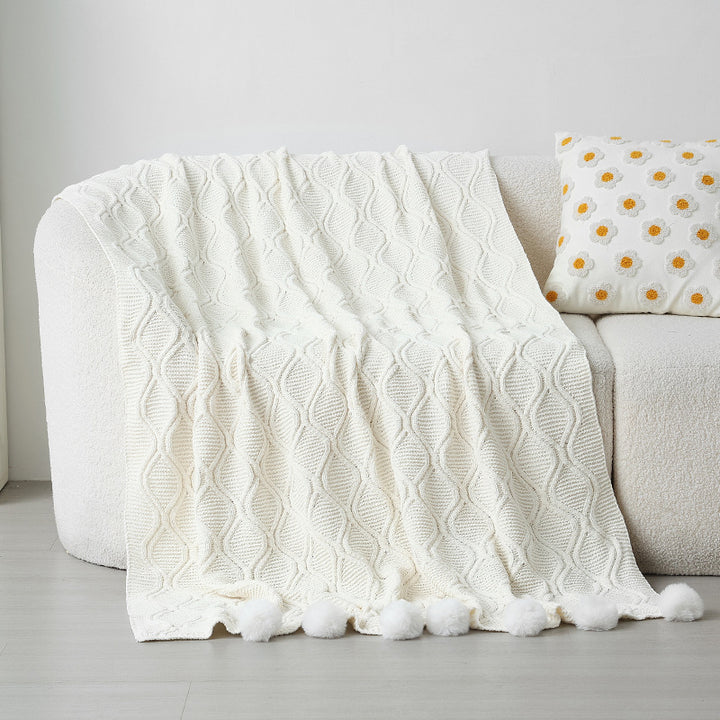 Ladies knit blanket with decorative pom poms Stornfield