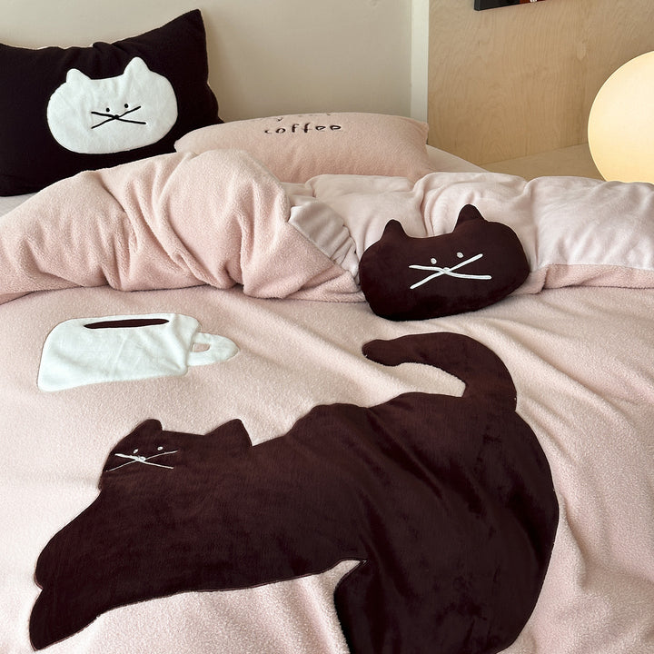 Cozy bedding set with embroidered cat appliqués and soft fleece surface