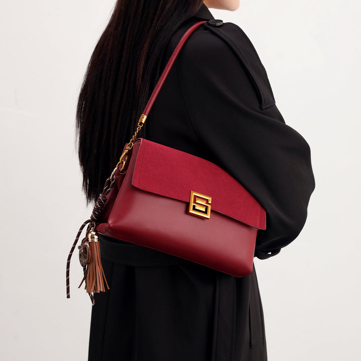 Elegant Suede Handbag with Gold Accents