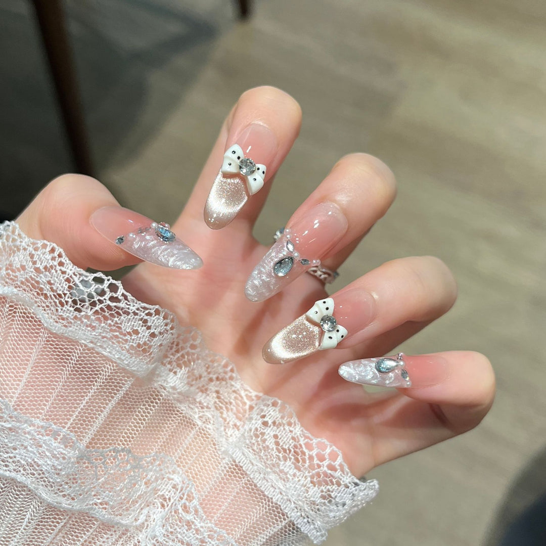 Elegant Nail Art Extensions with Pearl Accents Stornfield