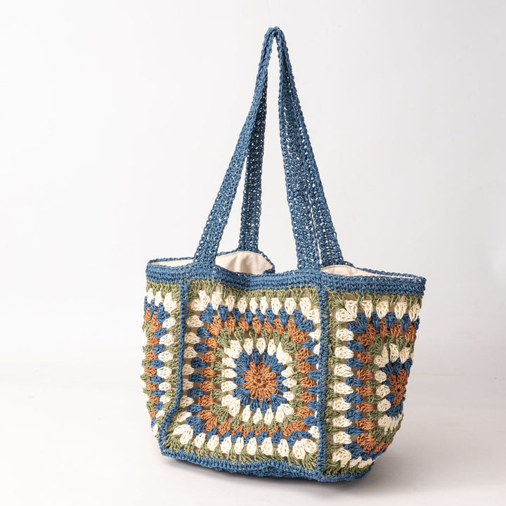 Beach bag made of hand-woven natural material with a square pattern Stornfield