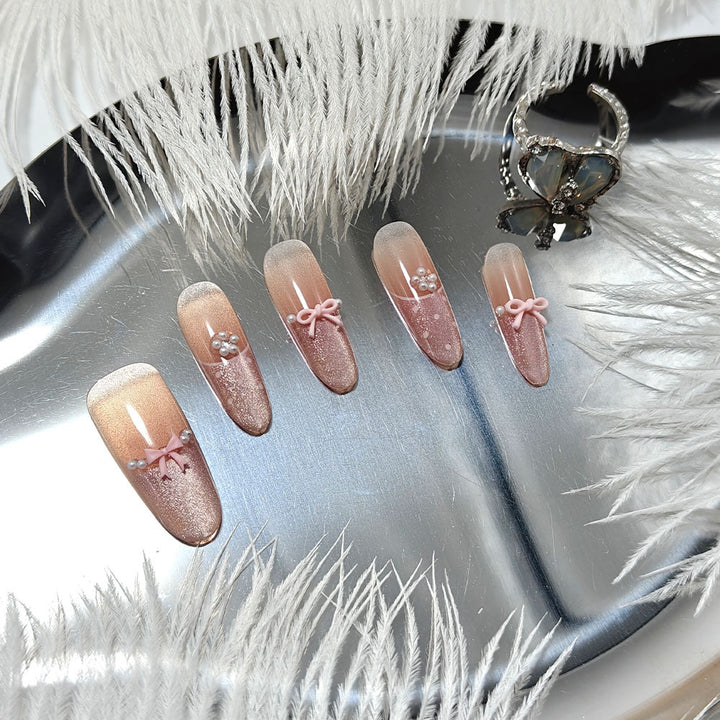 Elegant artificial nails with bows and pearl decoration Stornfield