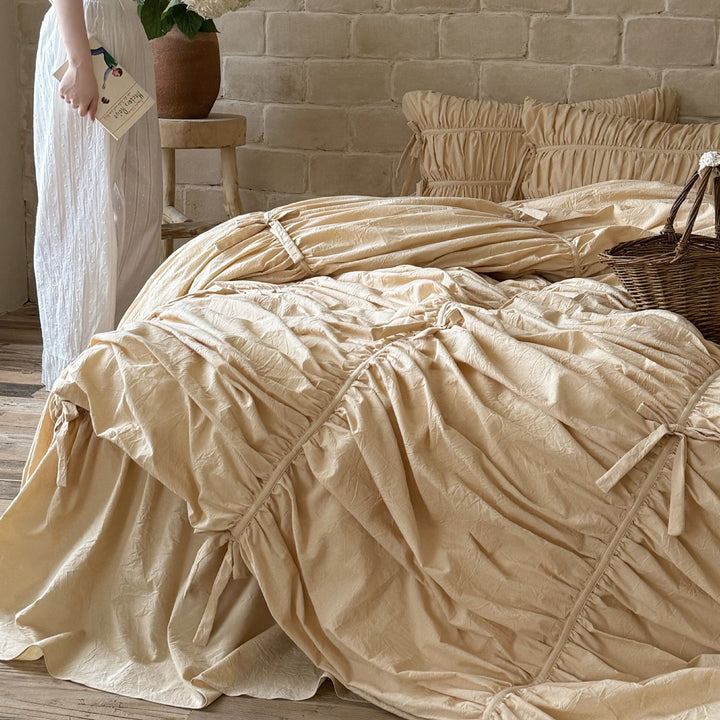 Luxurious gathered bedding set with ruffle, frills, and ties