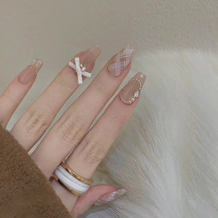 Elegant Press-On Nail Art Set with Ribbons and Gemstone Accents Stornfield