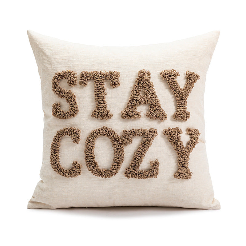 Square decorative cushion cover made of mottled bouclé weave with subtle piping Stornfield