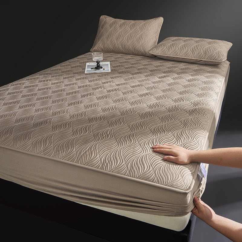 Quilted mattress topper as fitted cover with non-slip underside