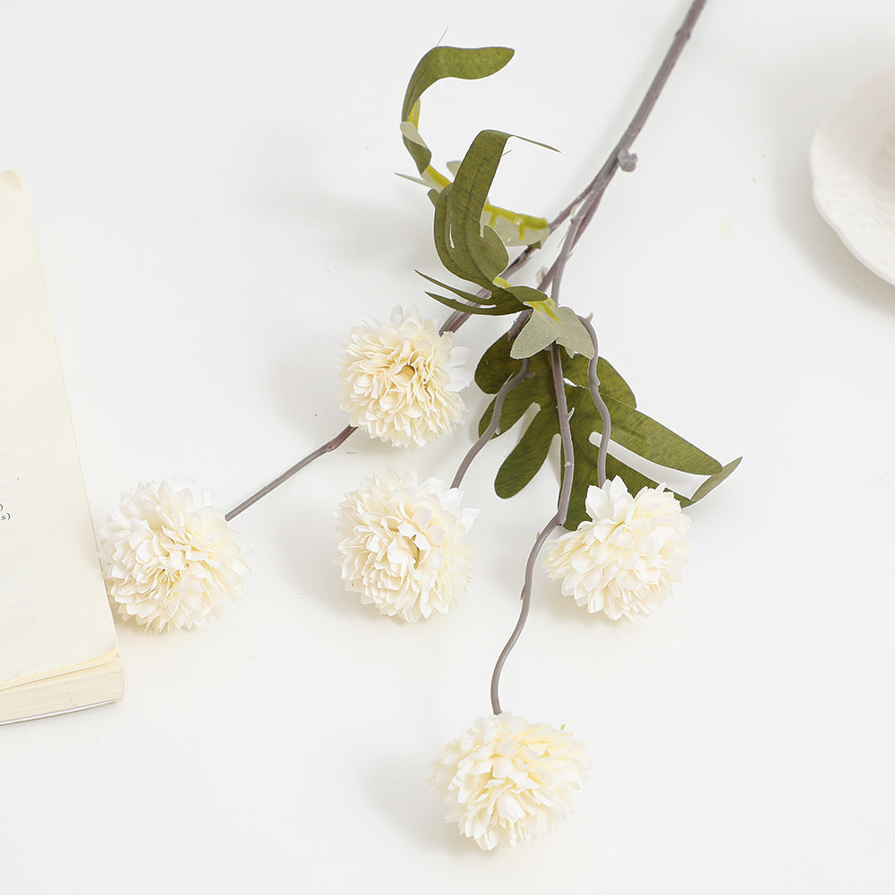 Artificial flower branch with intricate flowers