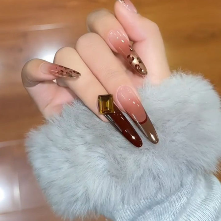 Artificial nails with elegant glitter and gold accent design Stornfield