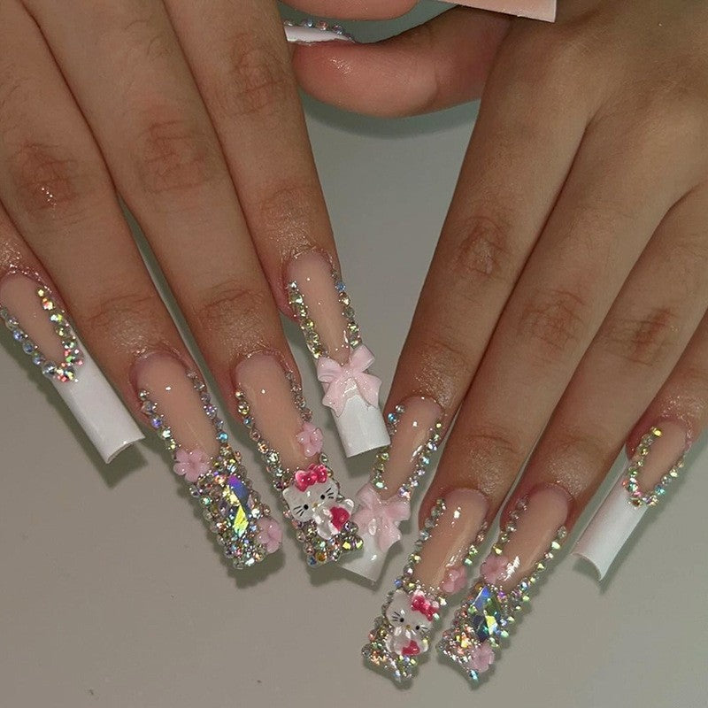 Glamorous artificial nail set with sparkling rhinestone embellishments and creative animal designs Stornfield