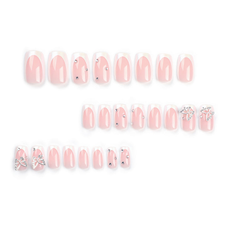 Elegant Nail Art with Glitter and Floral Accents Stornfield