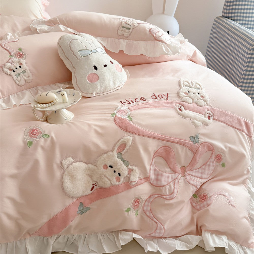 Romantic cotton satin bedding set with ruffles, plush appliqués and fine embroidery