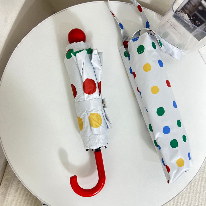 Ladies designer foldable umbrella with colorful polka dot pattern Stornfield