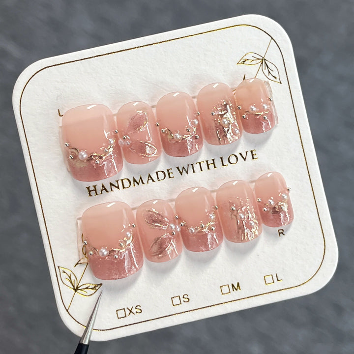 Handmade art nails with delicate embellishments Stornfield