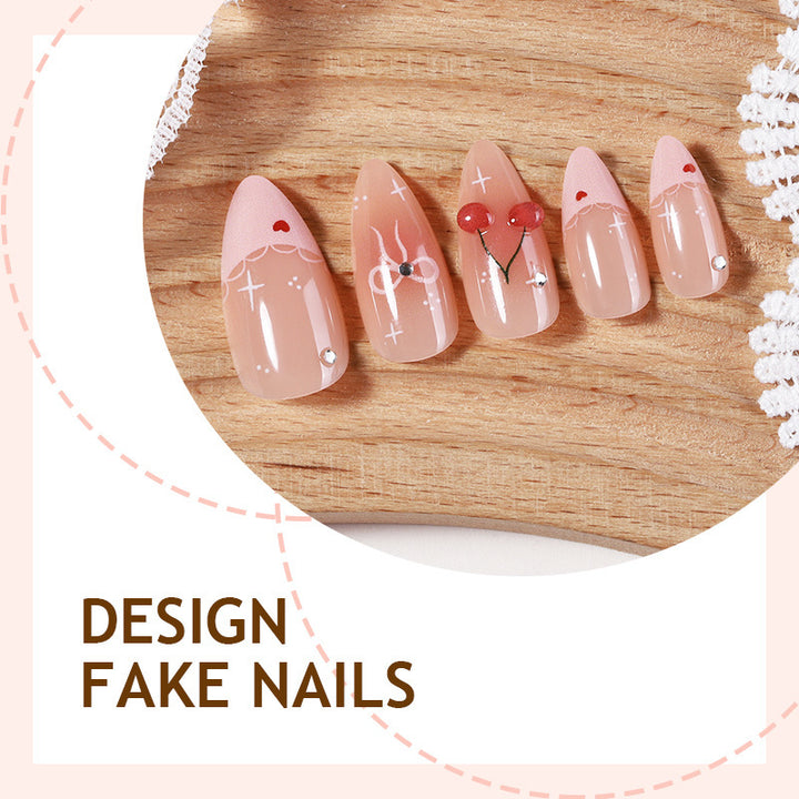 Artifical nails with playful heart and bow designs Stornfield