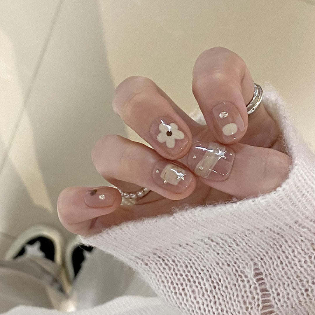 Artificial nails with elegant floral designs Stornfield