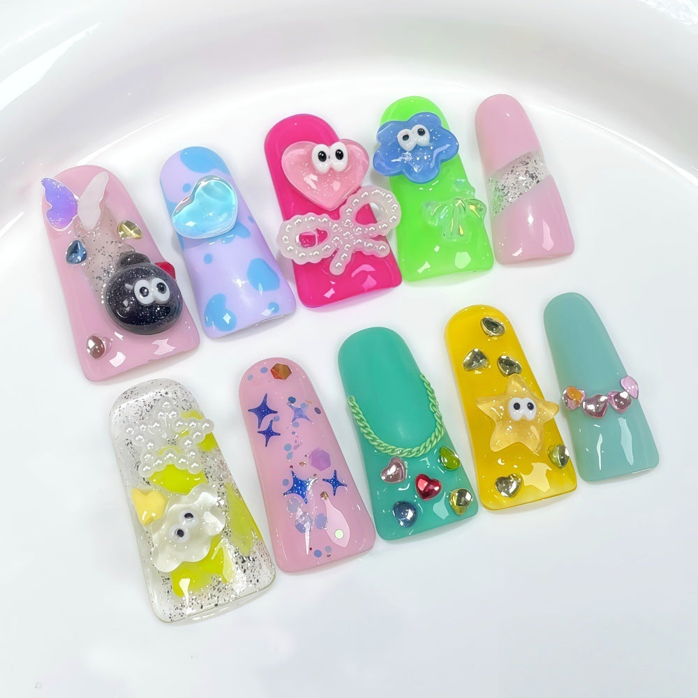 Creative press-on nails with playful 3D designs Stornfield