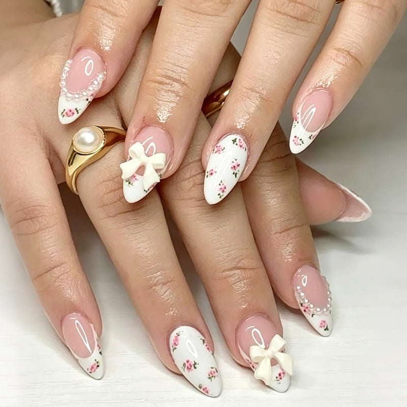 Artificial nail set with romantic flower motifs and elegant details Stornfield
