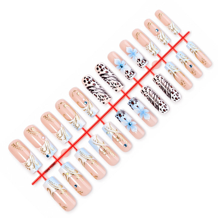 Glamorous artificial nail set with floral accents and glitter details Stornfield