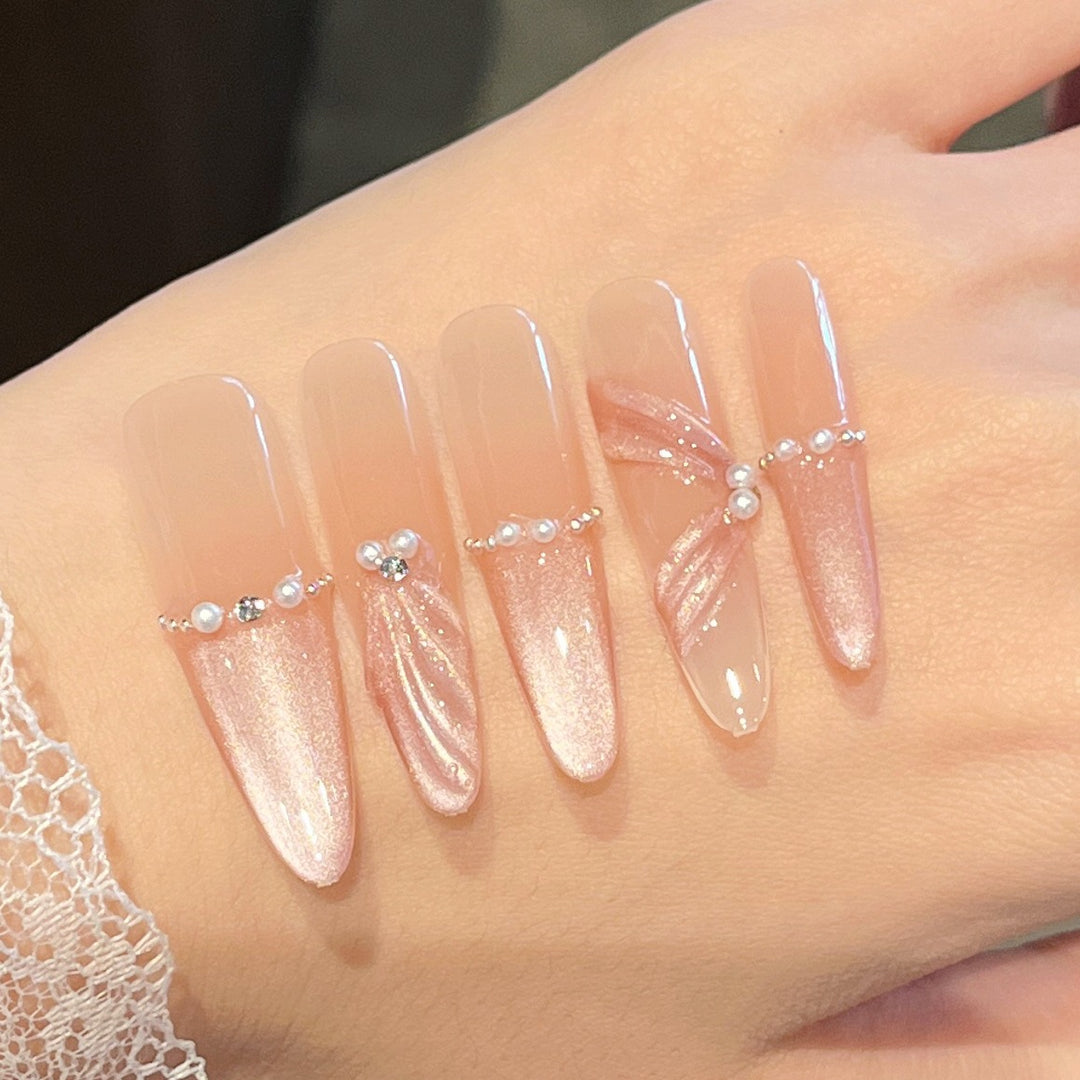 Artistic Stiletto Press-On Nail Art with Glimmering Accents Stornfield