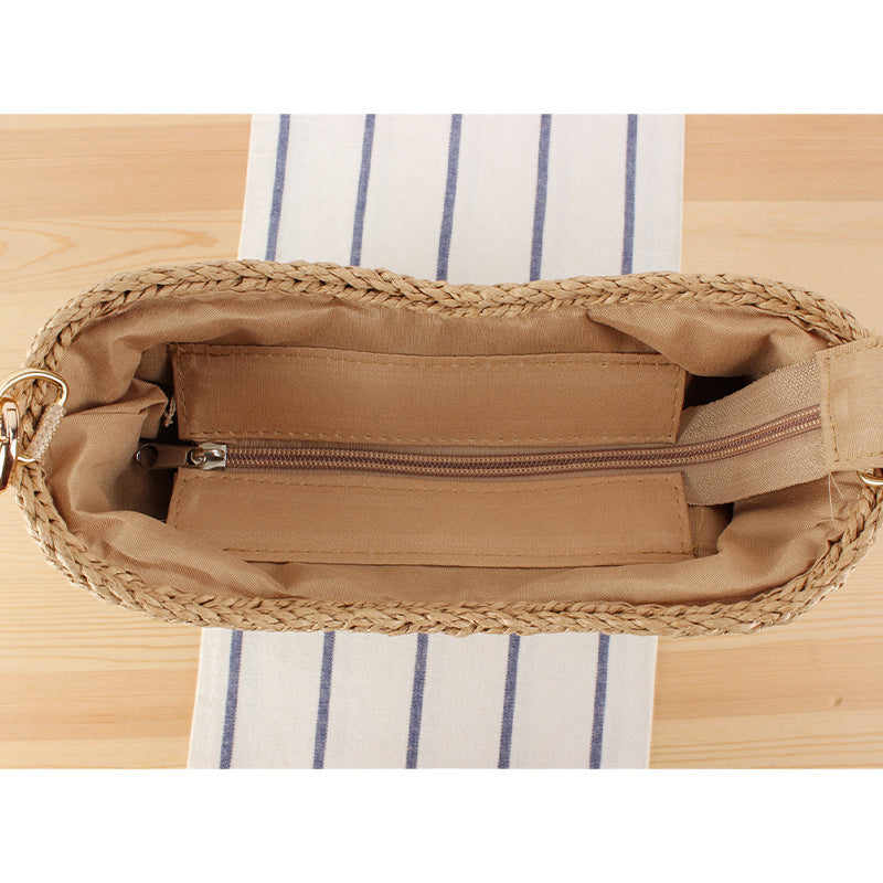 Stylish handbag made of woven natural material with exclusive chain accents Stornfield