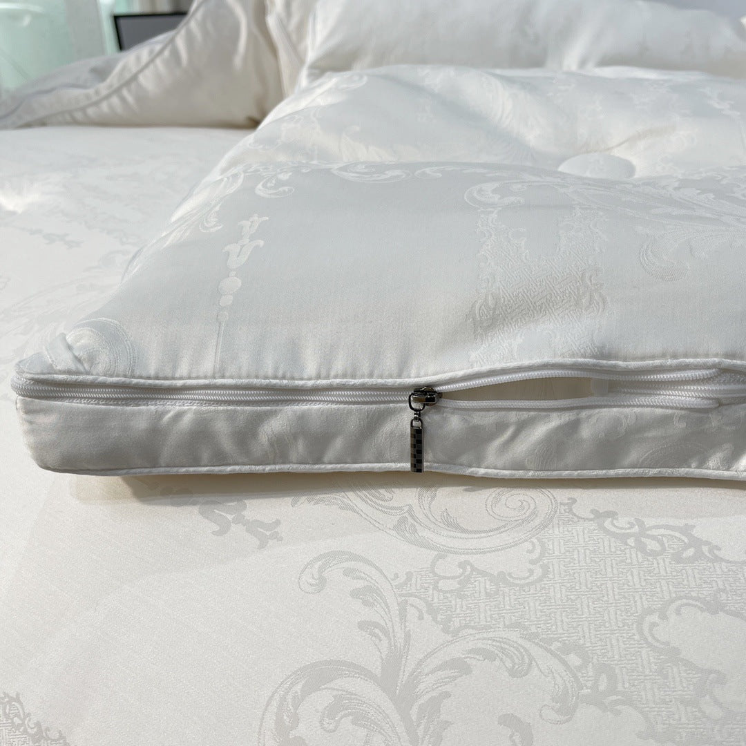 Quilted down look comforter with fine jacquard satin cover and crown embroidery