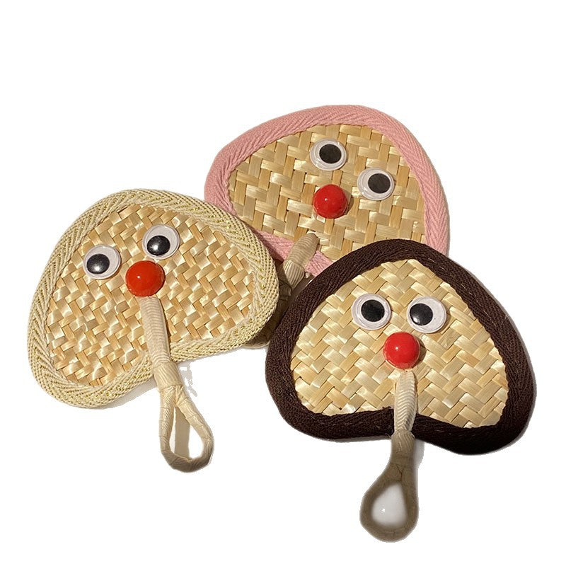Handcrafted fan with playful face motif Stornfield