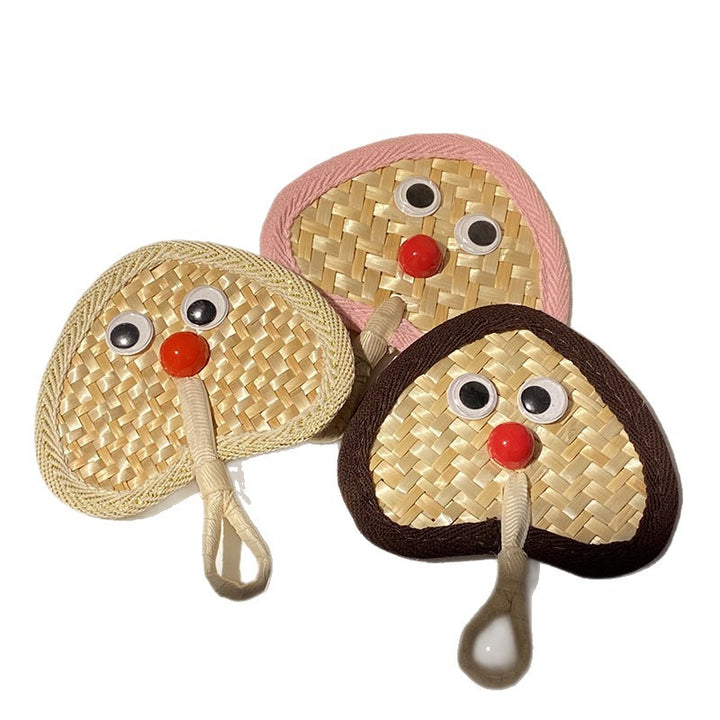 Handcrafted fan with playful face motif Stornfield