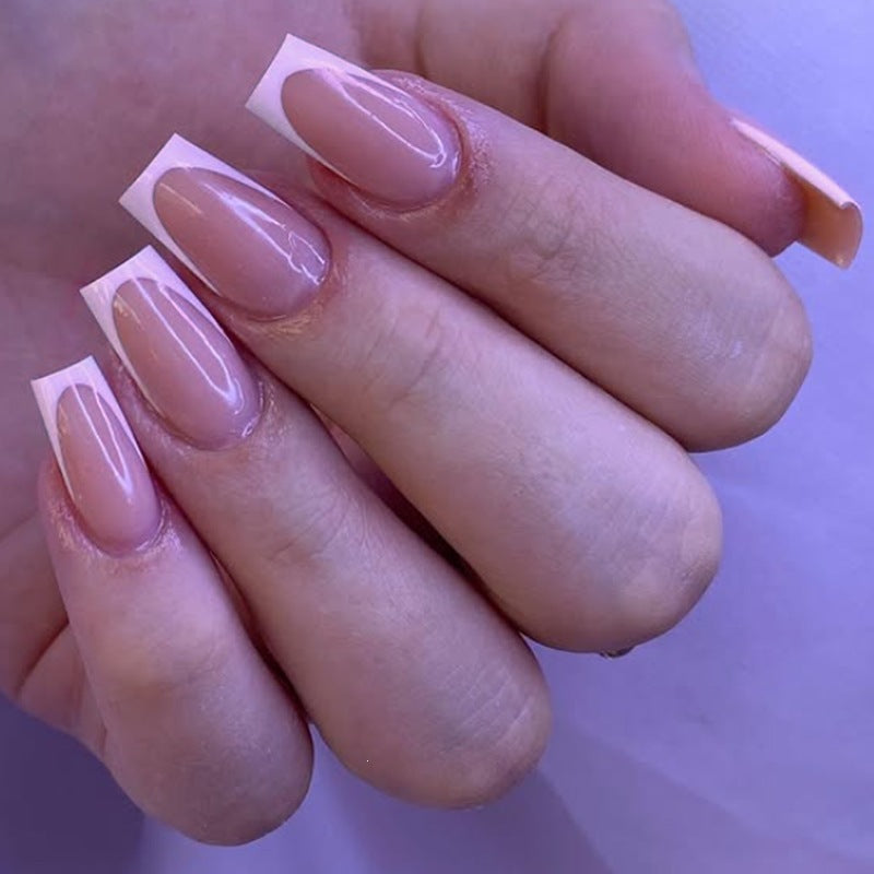 Acrylic nail set with elegant French tips and nourishing accessories Stornfield