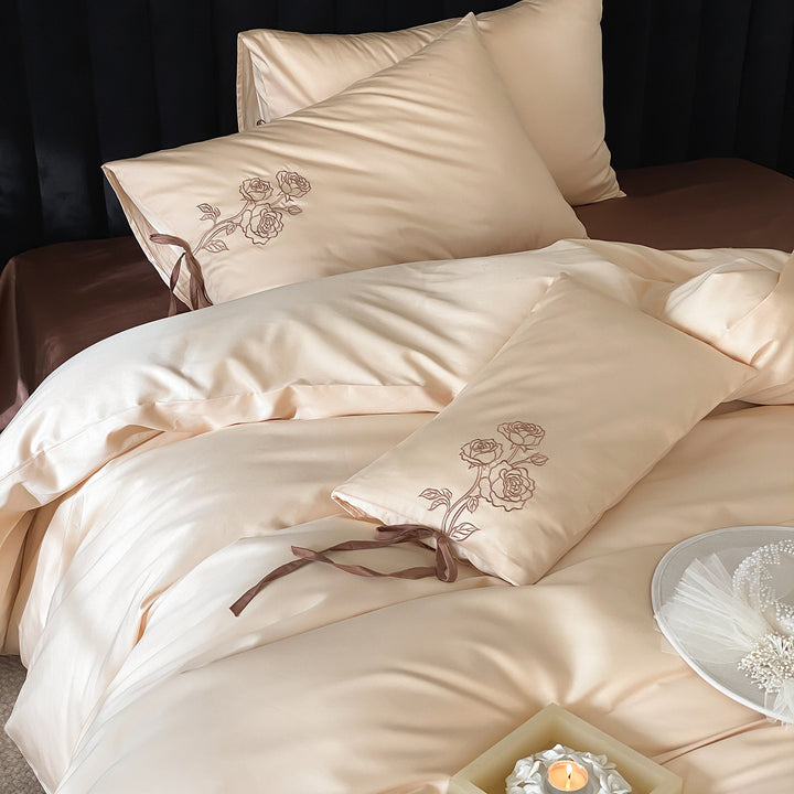 Premium cotton satin bedding set with botanical embroidery and decorative cushion ties