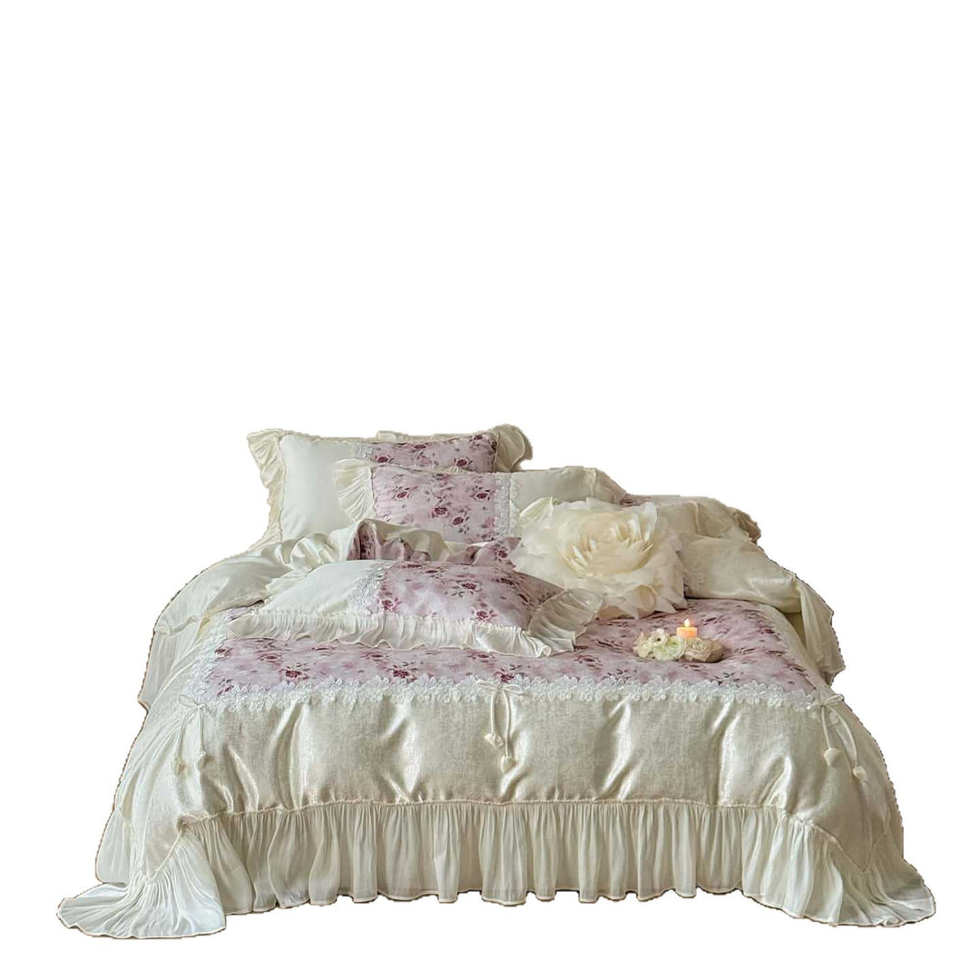 Romantic bedding and bedspread set with ruffles, lace trim, and floral quilting