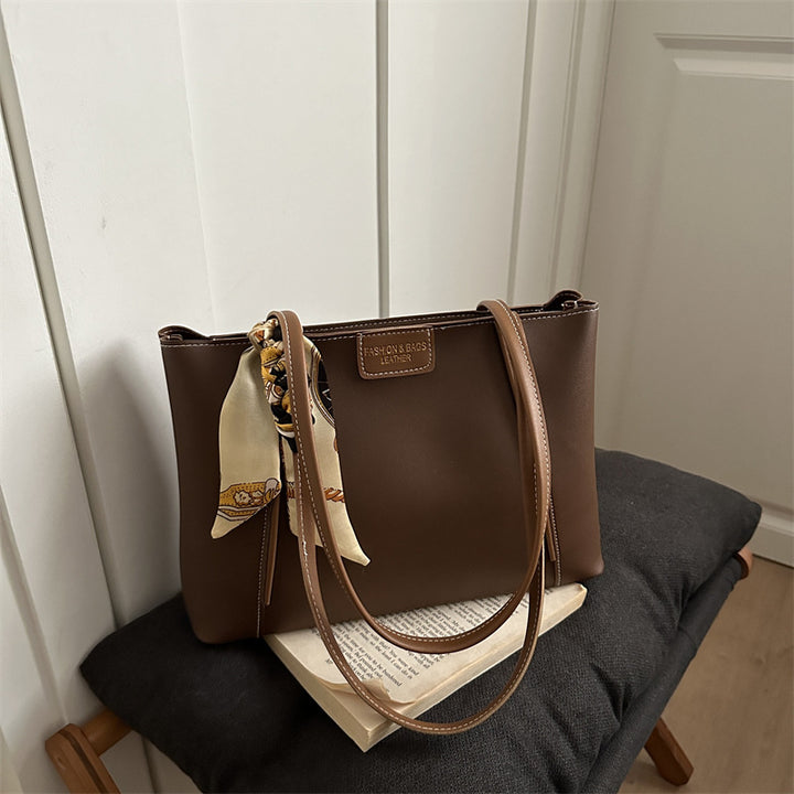 Elegant Leather Tote Bag with Decorative Scarf