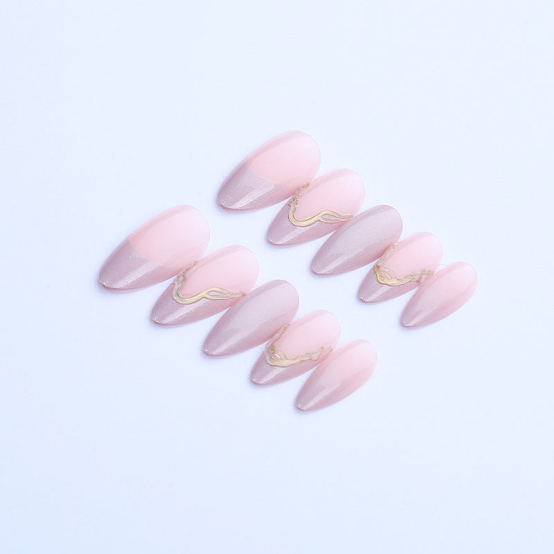 Acrylic nail set with glamorous tips and golden accents Stornfield