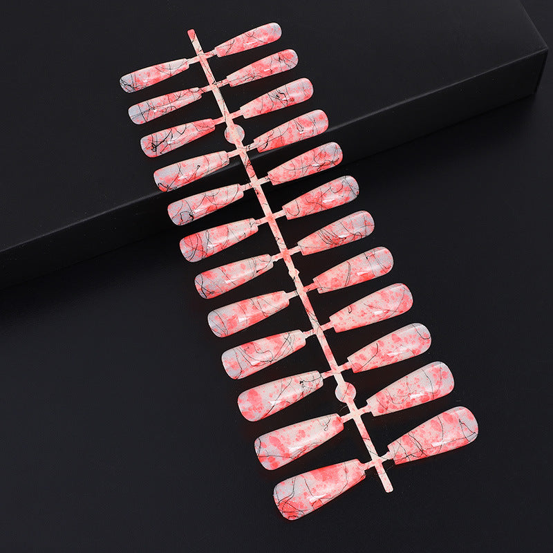 Creative nail art with blood splatter design Stornfield