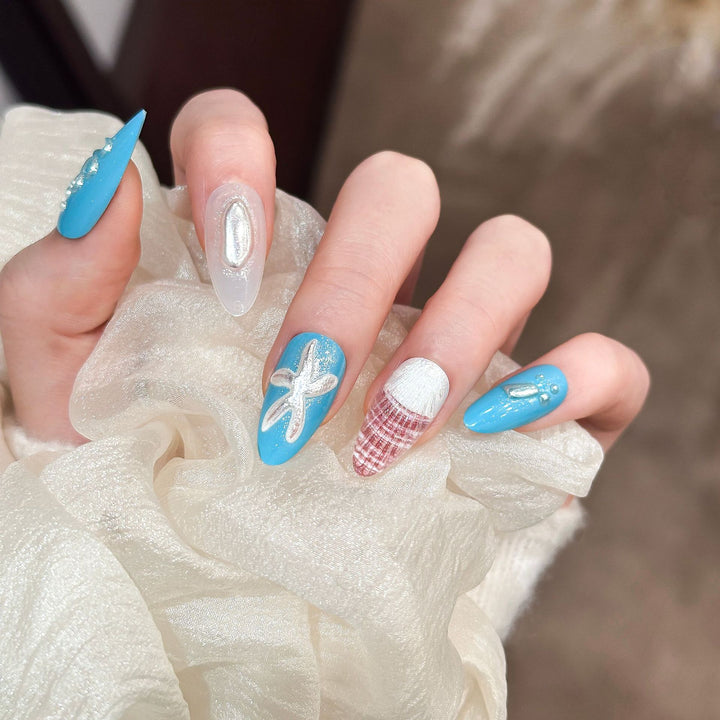 Artistic Press-On Nail Set with Ocean-Themed Designs
