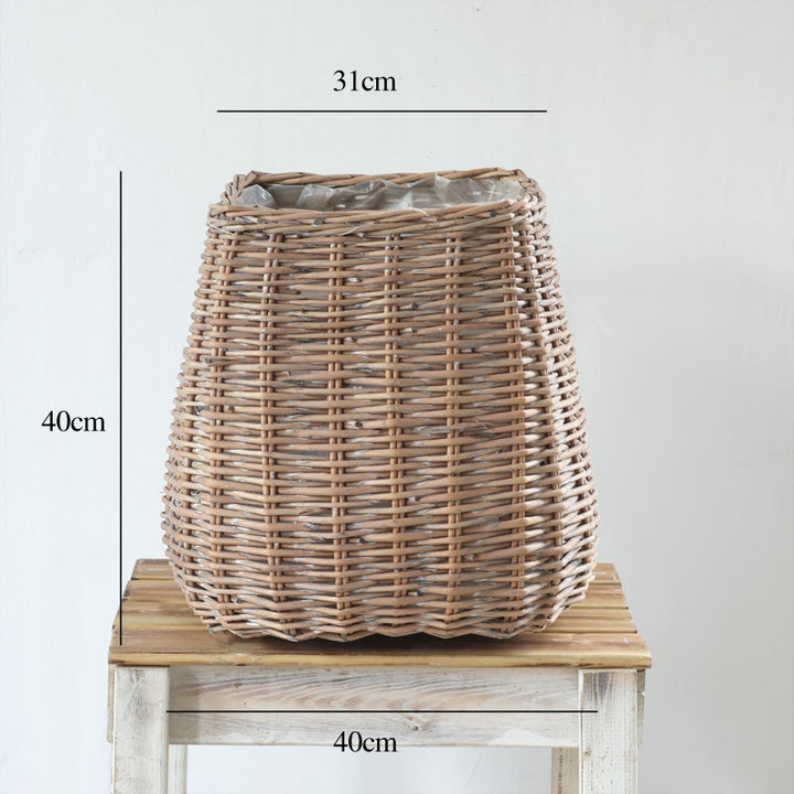 Stylish laundry basket made of braided natural material Stornfield