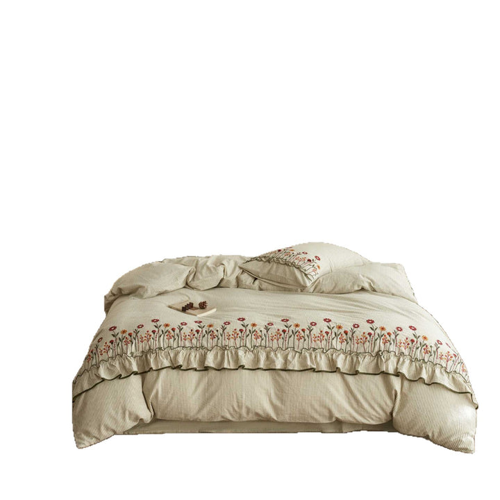 Cotton-linen duvet cover set with fine pinstripe texture, floral embroidery and curved frill