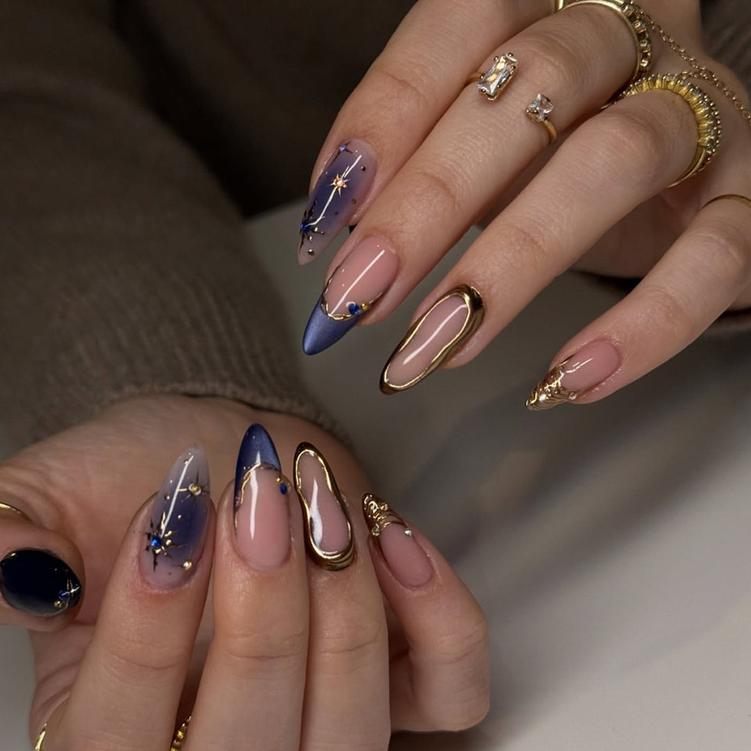 Artificial nails with elegant gold accents Stornfield