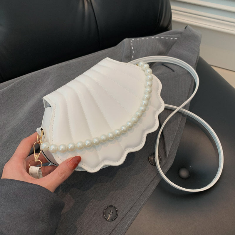 Elegant Pearl-Handled Clutch
