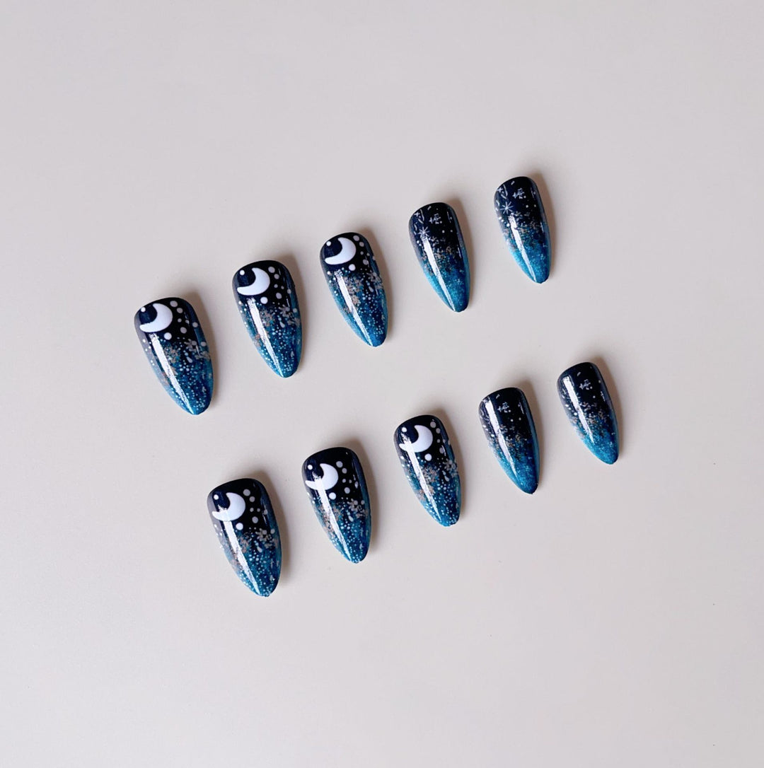 Glamorous artificial nails with sparkling star and moon motifs Stornfield