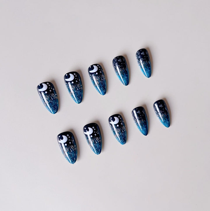 Glamorous artificial nails with sparkling star and moon motifs Stornfield