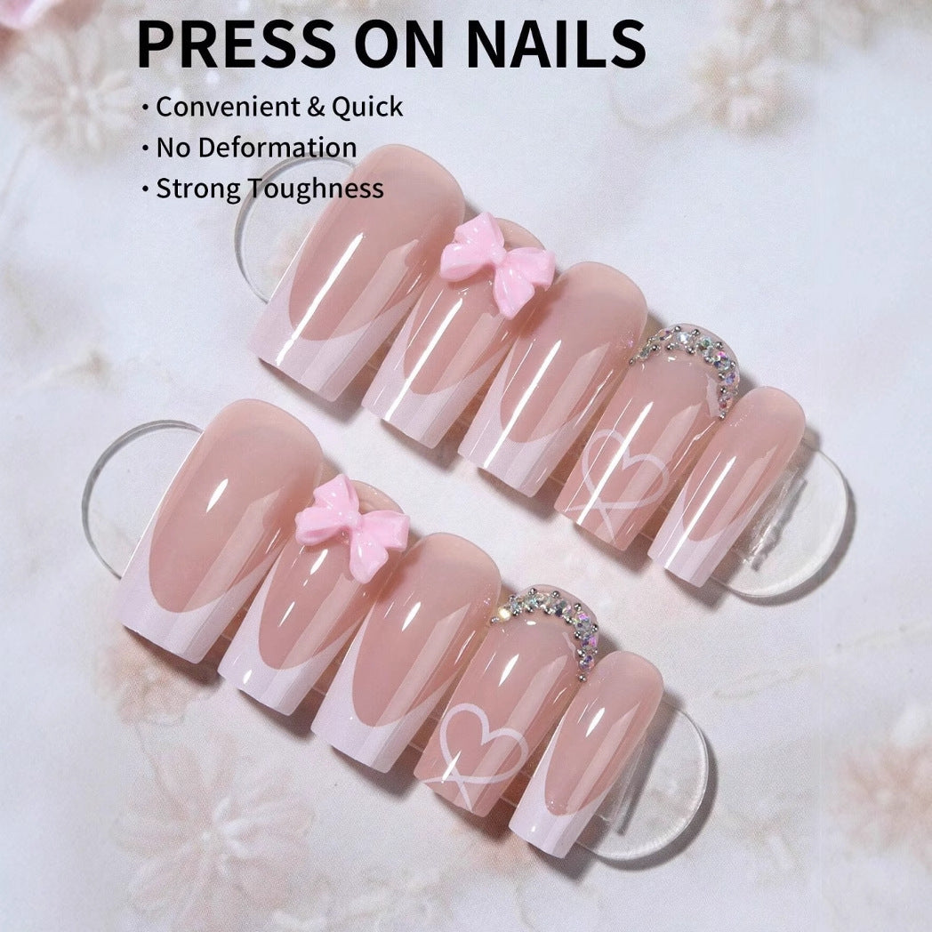 Artificial nail set with elegant bow and glitter decorations Stornfield