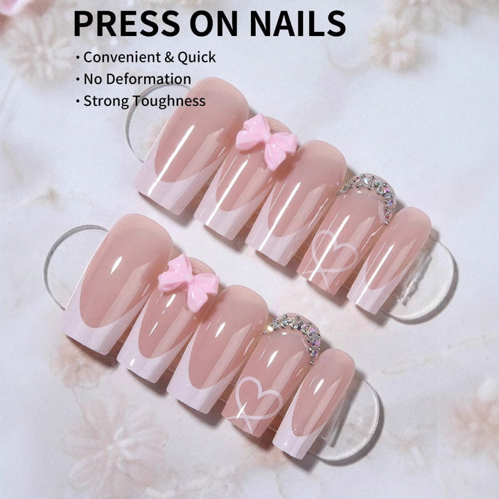 Artificial nail set with elegant bow and glitter decorations Stornfield
