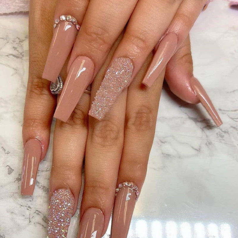 Glamorous artificial nail extensions with rhinestone and glitter details Stornfield