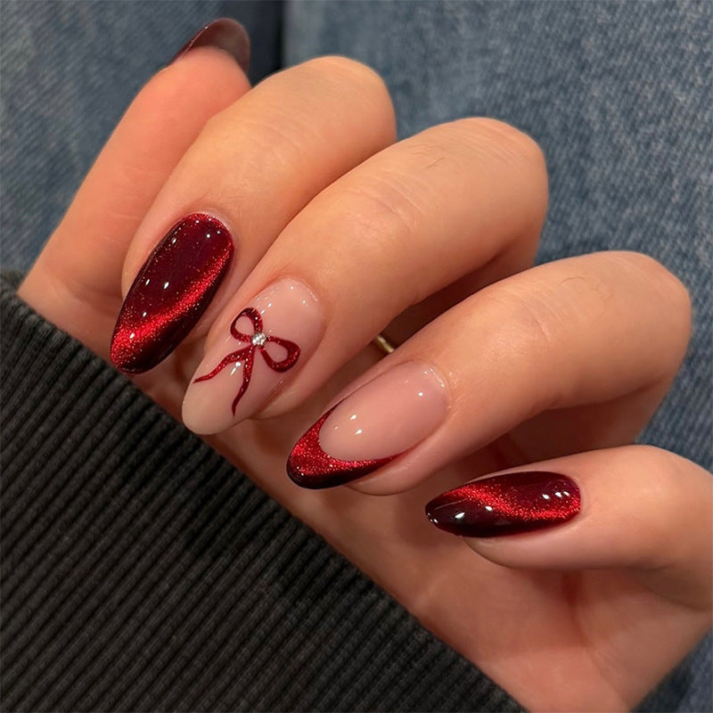 Designer artificial nails with elegant bow decoration Stornfield