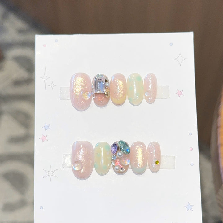 Artificial nails with shimmering effects and crystal accents Stornfield