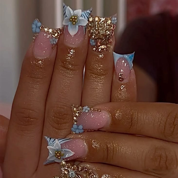 Artful Nail Extensions with Floral Design and Glitter Stornfield