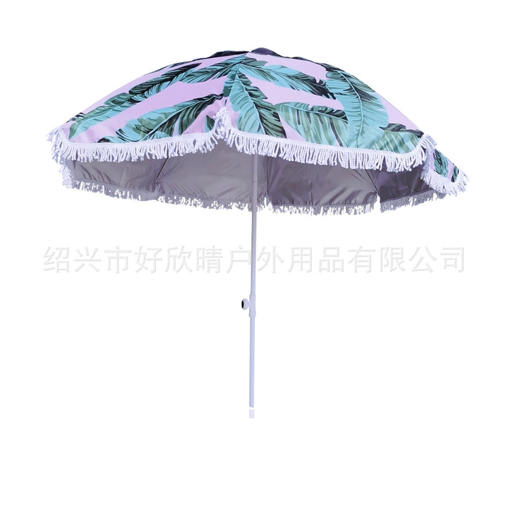 Ladies sun umbrella with tropical leaf design and tassel decoration Stornfield