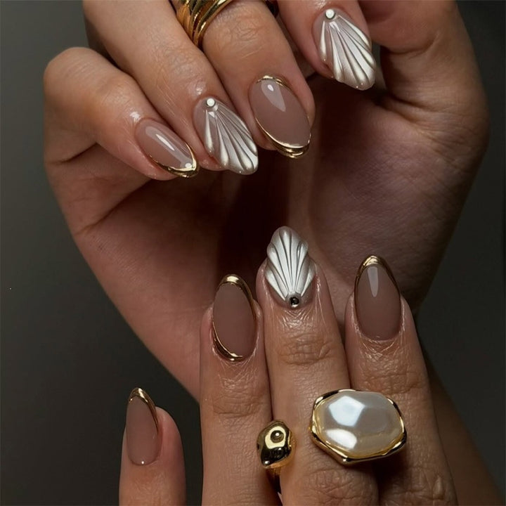 Artificial nail set with elegant shell design and glitter accents Stornfield