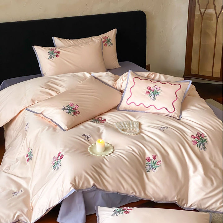 Fine cotton satin bedding set with embroidered tulip bouquets and contrasting piping
